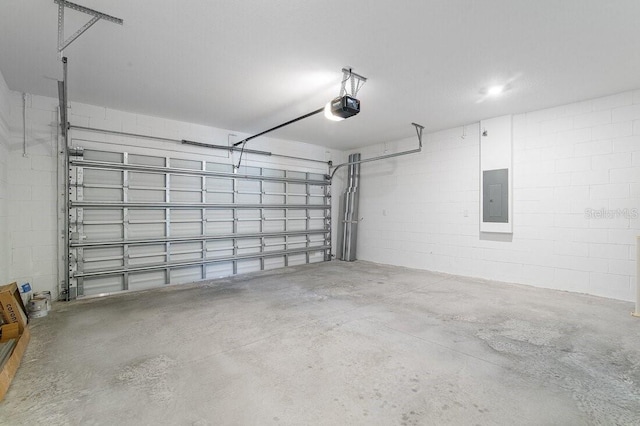 garage featuring a garage door opener and electric panel