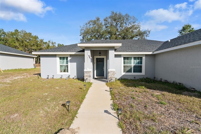 view of front of property with a front lawn