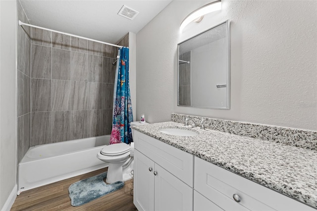 full bathroom featuring shower / bathtub combination with curtain, toilet, vanity, and hardwood / wood-style flooring