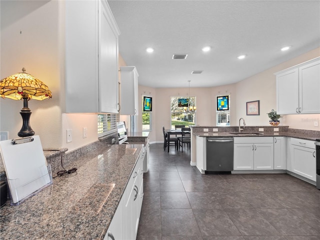 kitchen with decorative light fixtures, white cabinetry, dishwasher, sink, and kitchen peninsula