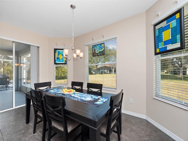 dining space with a notable chandelier