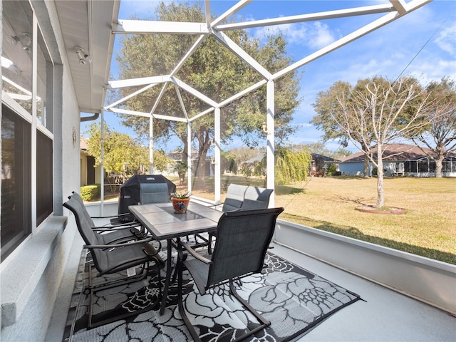 view of patio featuring a lanai