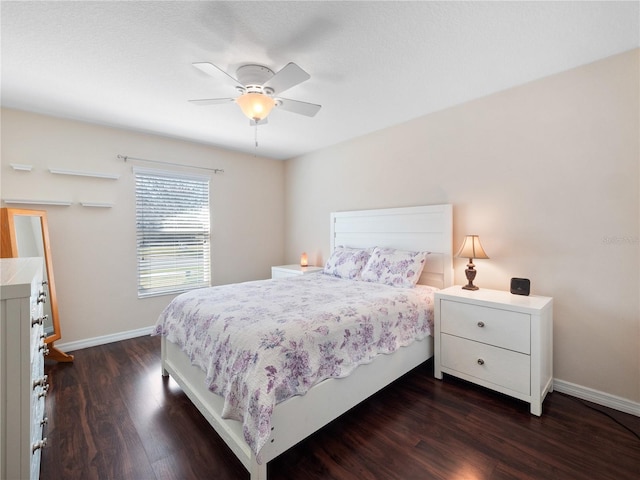 bedroom with dark wood-type flooring and ceiling fan