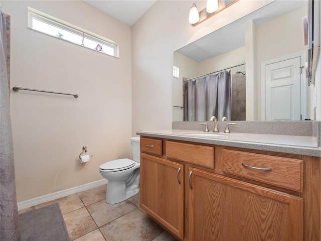 bathroom with tile patterned floors, vanity, toilet, and curtained shower