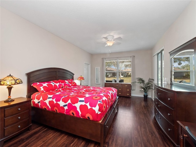 bedroom featuring ceiling fan and dark hardwood / wood-style floors