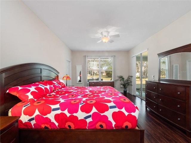 bedroom featuring dark wood-type flooring, ceiling fan, and a closet