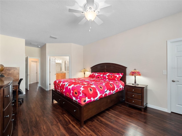 bedroom featuring ceiling fan, dark hardwood / wood-style floors, a textured ceiling, and ensuite bathroom