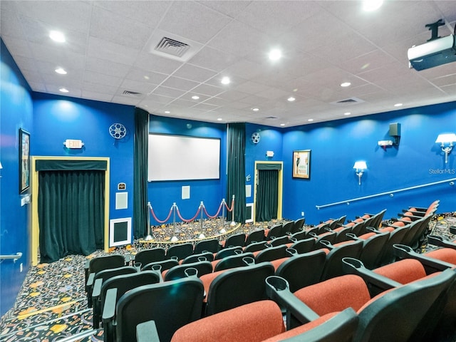 home theater with a paneled ceiling