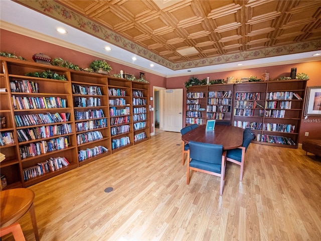 home office featuring ornamental molding and light hardwood / wood-style flooring