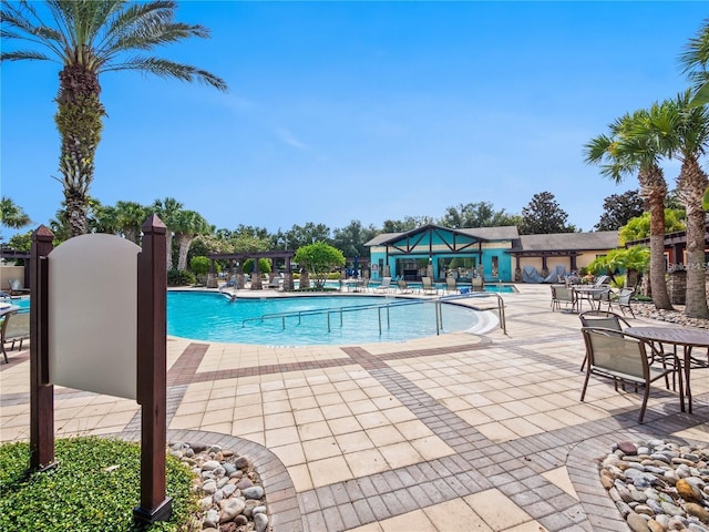 view of swimming pool featuring a patio area