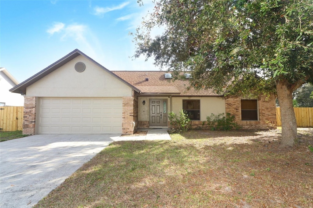 single story home with a garage