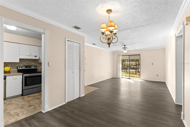 interior space with stainless steel electric range, white cabinets, ceiling fan with notable chandelier, crown molding, and tasteful backsplash