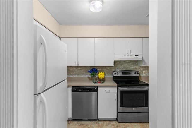 kitchen featuring white cabinets, backsplash, and stainless steel appliances