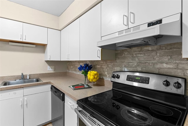 kitchen featuring decorative backsplash, white cabinetry, sink, and appliances with stainless steel finishes