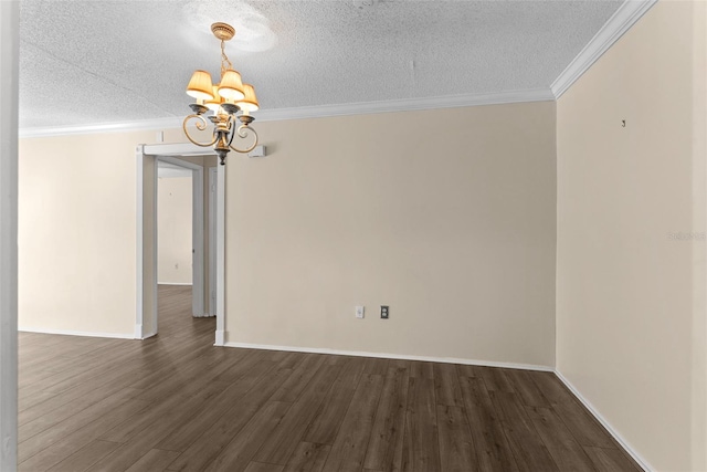 unfurnished room with a textured ceiling, ornamental molding, dark wood-type flooring, and a chandelier