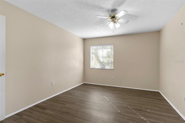 empty room featuring a textured ceiling, dark hardwood / wood-style flooring, and ceiling fan