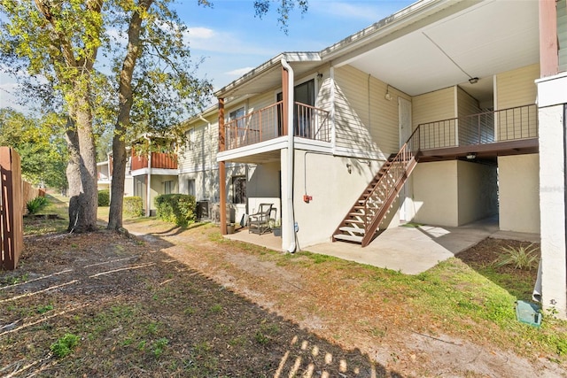 back of house with a patio area