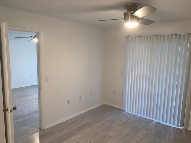 spare room with hardwood / wood-style floors