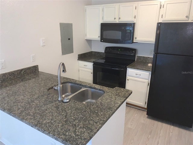 kitchen with black appliances, white cabinets, kitchen peninsula, and electric panel