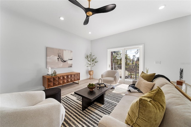 living room with ceiling fan and hardwood / wood-style flooring