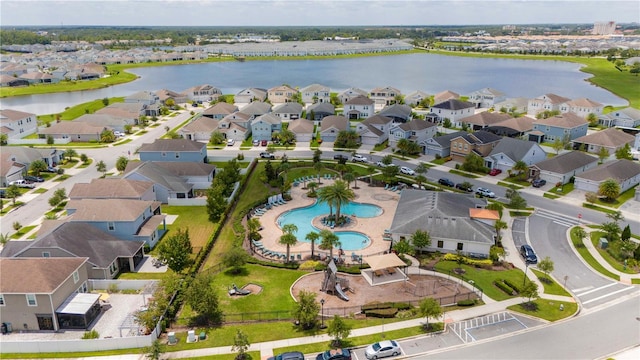 birds eye view of property featuring a water view