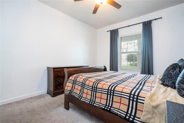 bedroom with ceiling fan and light carpet