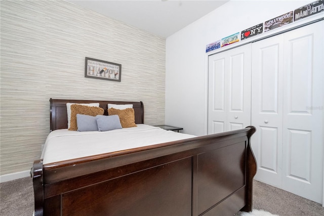 bedroom with carpet and a closet