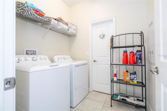 laundry room with light tile patterned flooring and independent washer and dryer