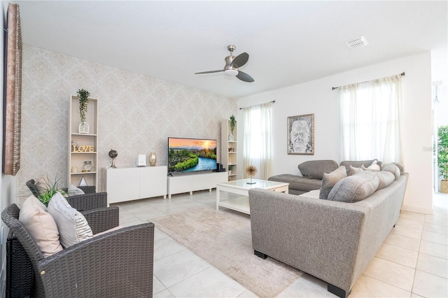 tiled living room featuring ceiling fan