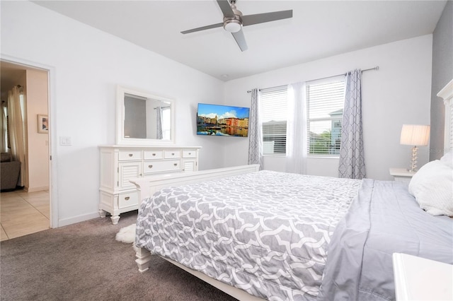 bedroom with ceiling fan and light carpet