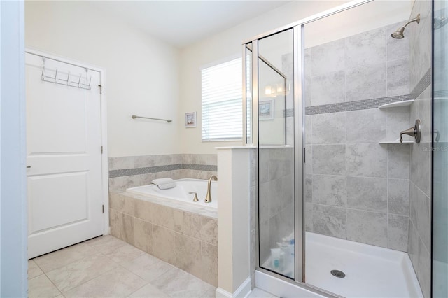 bathroom featuring plus walk in shower and tile patterned floors