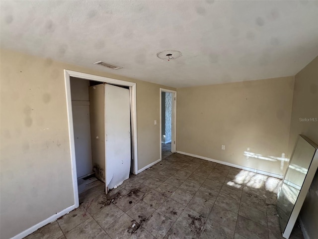 unfurnished bedroom featuring a closet