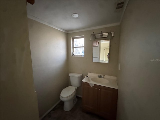 bathroom featuring vanity, toilet, and crown molding