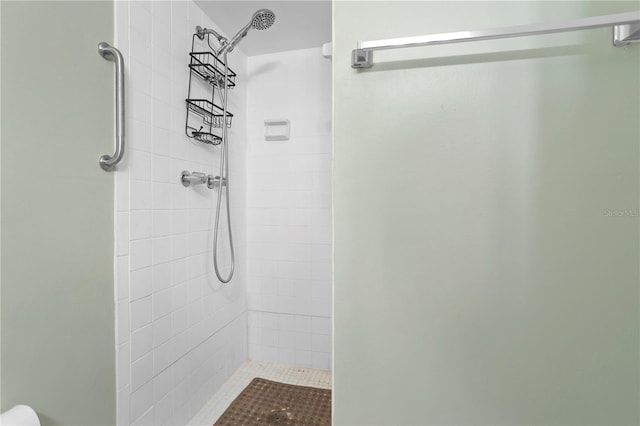 bathroom with tiled shower