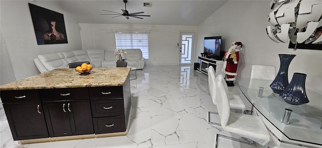 kitchen with visible vents, marble finish floor, a ceiling fan, and open floor plan