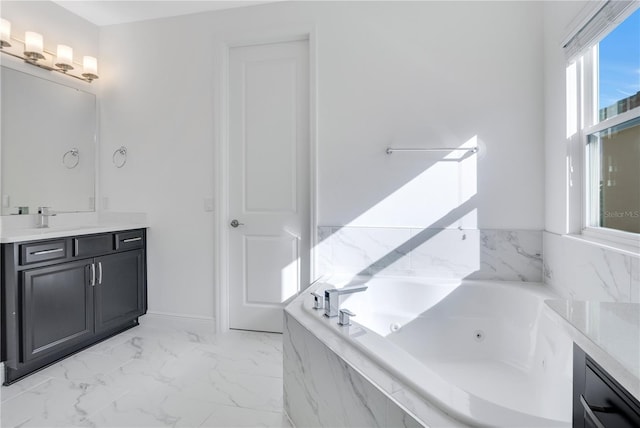 bathroom featuring a relaxing tiled tub and vanity