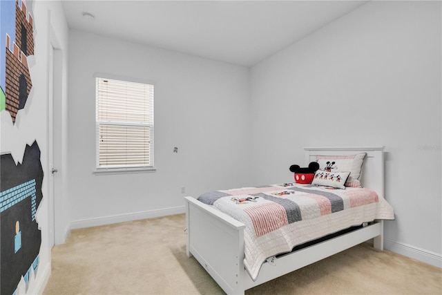 bedroom with light colored carpet