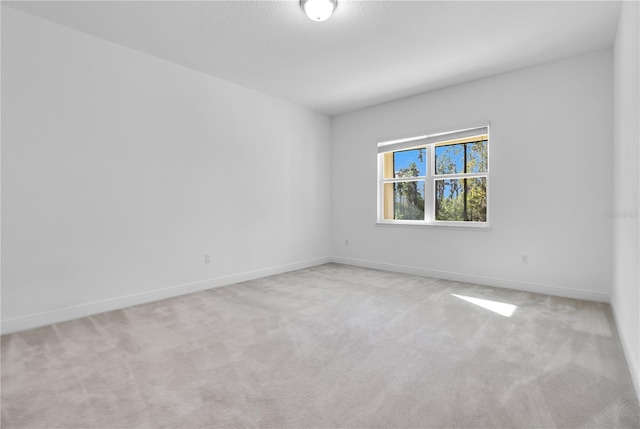 empty room featuring light carpet