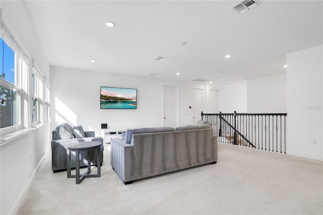 living room featuring light carpet