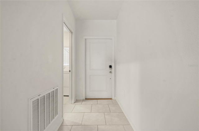 corridor featuring light tile patterned floors