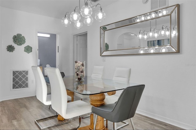 dining area featuring hardwood / wood-style floors