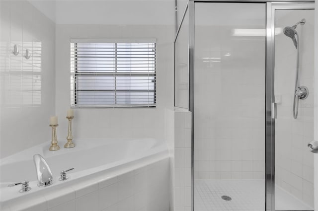 bathroom featuring plus walk in shower