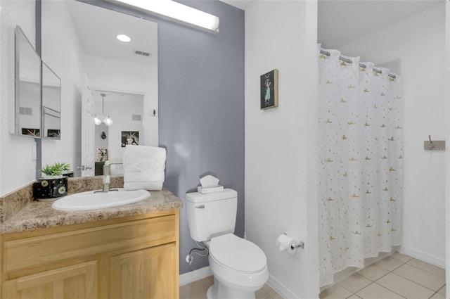 bathroom with a shower with curtain, tile patterned flooring, vanity, and toilet