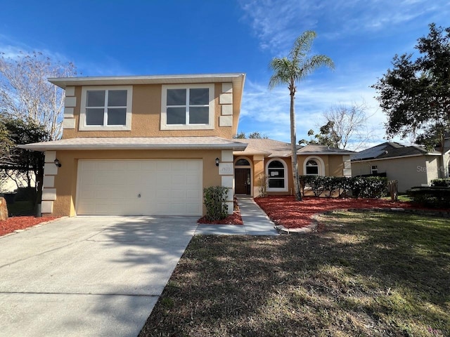 view of front of house with a garage and a front yard