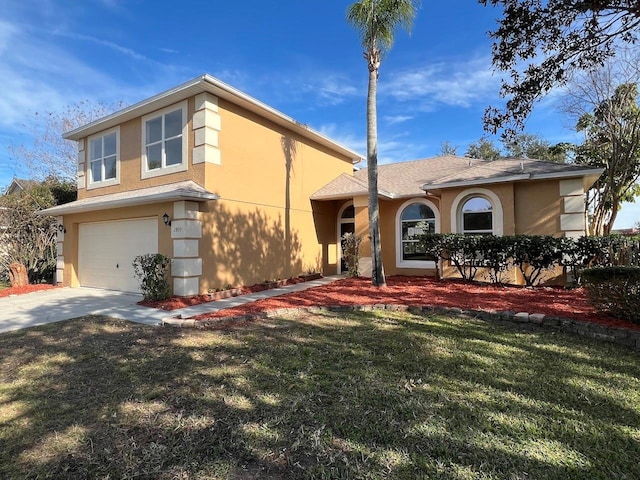 view of front of house with a garage and a front yard