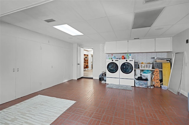 laundry area featuring washing machine and clothes dryer