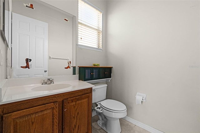 1108 Darnaby Way, Orlando, FL 32824 - half bathroom featuring vanity, baseboards, tile patterned floors, and toilet