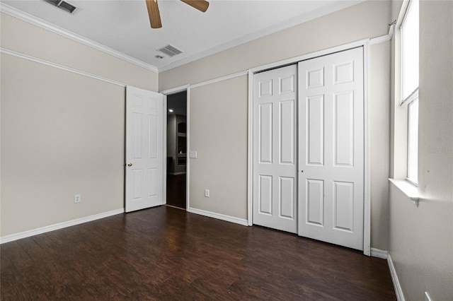 1108 Darnaby Way, Orlando, FL 32824 - unfurnished bedroom with visible vents, ornamental molding, dark wood finished floors, and baseboards