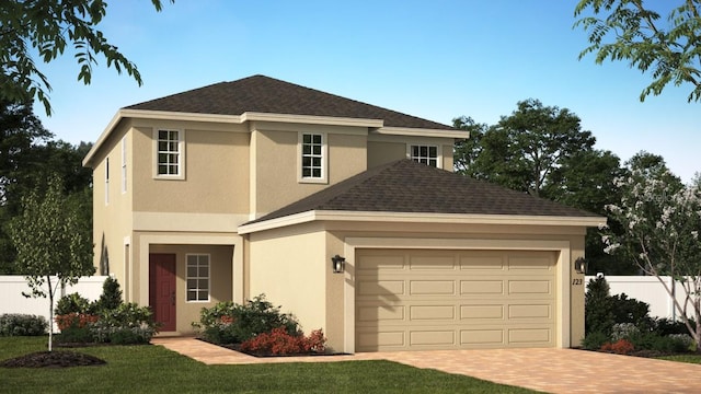 view of front facade featuring a front lawn and a garage