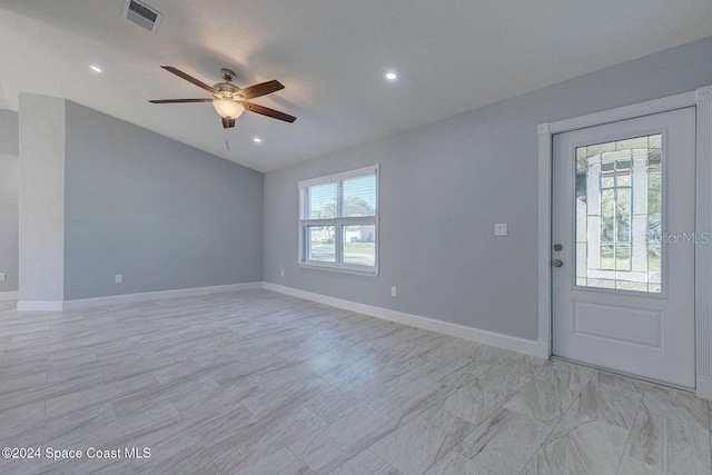 interior space with baseboards, visible vents, ceiling fan, vaulted ceiling, and recessed lighting